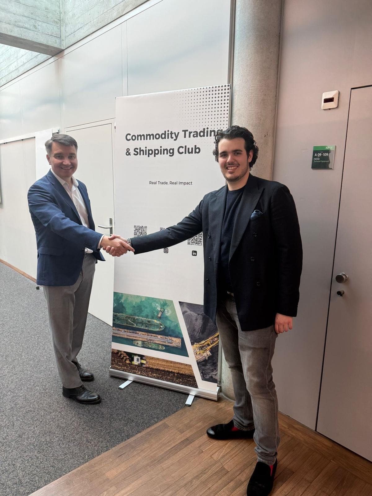 Alexei Solovyev with a CTSC host in front of the club's banner